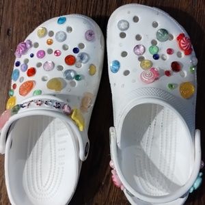 Little girl sz 3 Crocs with built on jibits. Crocs still have a lot of life